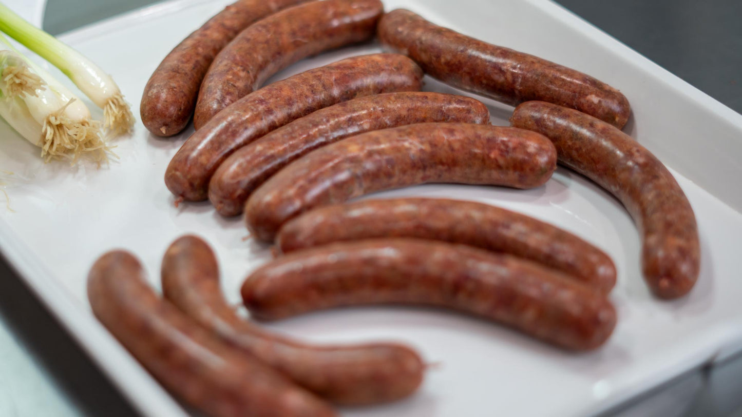 Merguez sausages on white plate