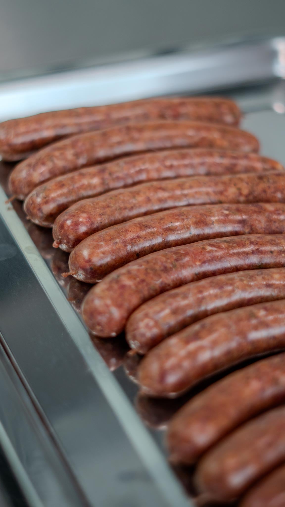 Merguez sausages on silver platter